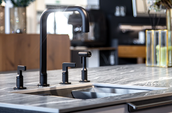 Sleek and modern black mixer tap in a kitchen