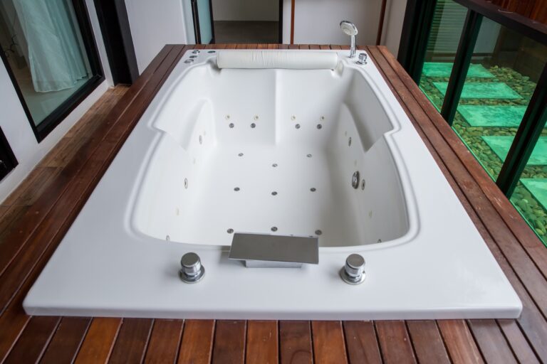 an empty jetted bathtub